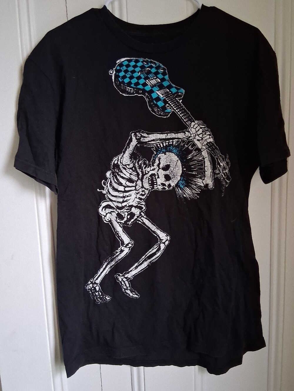 Tell the People Graphic T-ShirBlack Skeleton Guitar Graphic Tee with Teal Accent